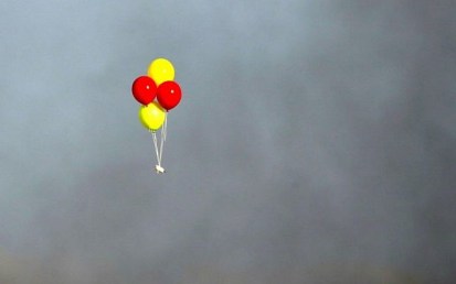 Incendiary balloons are flown toward Israel during clashes between Palestinians and Israeli troops east of Gaza City, along the border between the Gaza Strip and Israel, on July 13, 2018. (AFP Photo/Mahmud Hams)