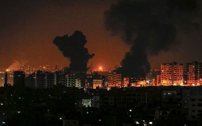 A picture taken on August 8, 2018 in Gaza City shows smoke plumes rising following an Israeli air strike. (AFP/MAHMUD HAMS)