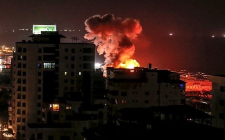 A picture taken on August 8, 2018 in Gaza City shows a smoke plume rising following an Israeli air strike. (AFP/ MAHMUD HAMS)