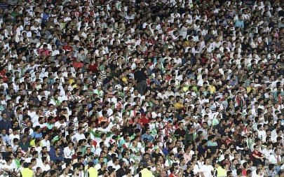 FILE -- Iranian soccer fans follow a qualifying match with Uzbekistan in their Asia Group A, 2018 Russia World Cup at the Azadi Stadium in Tehran, Iran, June 12, 2017 (AP Photo/Vahid Salemi)