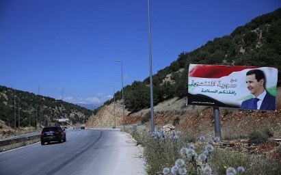 In this July 20, 2018, photo, a poster of President Bashar Assad with Arabic that reads "Welcome in victorious Syria." is seen on the border between Lebanon and Syria. (AP Photo/Hassan Ammar) In this July 20, 2018, photo, a poster of President Bashar Assad with Arabic that reads "Welcome in victorious Syria." is seen on the border between Lebanon and Syria. (AP Photo/Hassan Ammar)