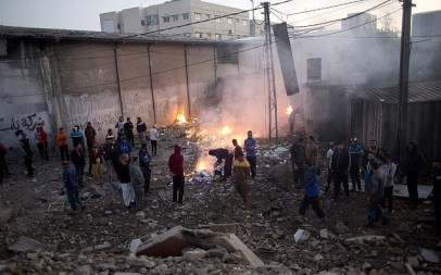 Palestinians check damage to buildings destroyed by Israeli airstrikes in Gaza City on October 27, 2018 after salvos of rocket fire from Gaza. (AP Photo/Khalil Hamra) Palestinians check damage to buildings destroyed by Israeli airstrikes in Gaza City on October 27, 2018 after salvos of rocket fire from Gaza. (AP Photo/Khalil Hamra)