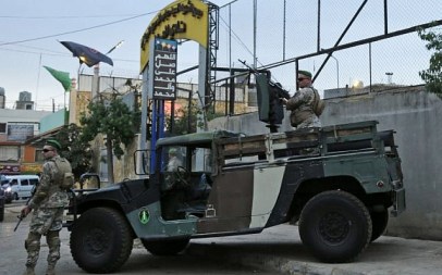 Lebanese security forces guard the entrance of Al-Ahed stadium in Beirut's southern suburbs during a tour organized by the Lebanese foreign minister for ambassadors on October 1, 2018 of alleged missile sites around the Lebanese capital in a bid to disprove Israeli accusations that the Hezbollah movement has secret missile facilities there. (AFP PHOTO / ANWAR AMRO)