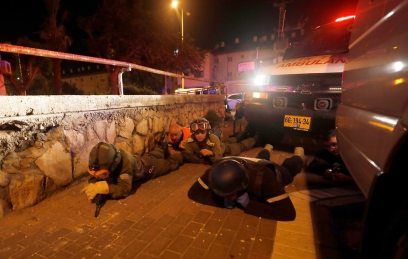 Soldiers stationed near the Gaza border take cover during rocket barrage (Photo: EPA)