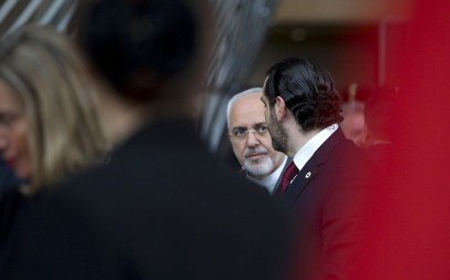Iranian Foreign Minister Mohammad Javad Zarif, center, speaks with Lebanon's Prime Minister Saad Hariri, right, after a group photo at a conference 'Supporting the future of Syria and the region' at the Europa building in Brussels on Wednesday, April 25, 2018. (AP Photo/Virginia Mayo)