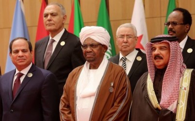 Omar al-Bashir, center, president of Sudan, stands between Egyptian president Abdel Fattah el-Sisi, left, and Bahrain's King Hamad bin Isa Al Khalifa at the annual Arab League summit on Wednesday, March 29, 2017 held this year on the Dead Sea in Jordan.  (AP Photo/ Raad Adayleh)