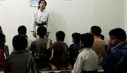 Boys recite poems during a session at a rehabilitation center for former child soldiers in Marib, Yemen, July 25, 2018.