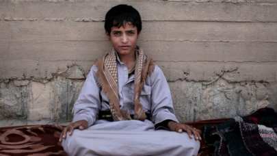 Abdel-Hamid, a 14-year-old former child soldier, poses for a photograph at a camp for displaced persons where he took shelter, in Marib, Yemen, July 27, 2018.