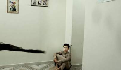 14 year-old Abdel Majeed sits on the floor at a rehabilitation center for former child soldiers in Marib, Yemen, July 25, 2018.