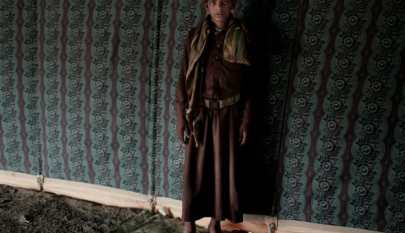 Nawaf, a 15-year-old former child soldier, poses for a photograph at a camp for displaced persons where he took shelter with his family, in Marib, Yemen, July 27, 2018.