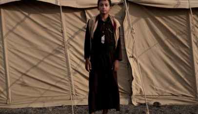 Sadek, a 14 year-old former child soldier,  poses for a photograph at a camp for displaced persons where he took shelter with his family, in Marib, Yemen, July 27, 2018.