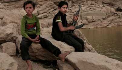 17 year-old boy holds his weapon in High dam in Marib, Yemen, July 30, 2018.