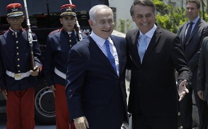 Israeli Prime Minister Benjamin Netanyahu, left center, is received by Brazil's President-elect Jair Bolsonaro at the military base Fort Copacabana, in Rio de Janeiro, Brazil, Friday, December 28, 2018.  (Leo Correa/Pool Photo via AP)