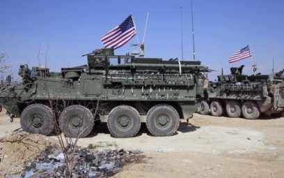 This Tuesday, March 7, 2017 frame grab from video provided by Arab 24 network, shows US forces take up positions on the outskirts of the Syrian town, Manbij, a flashpoint between Turkish troops and allied Syrian fighters and US-backed Kurdish fighters, in al-Asaliyah village, Aleppo province, Syria (Arab 24 network, via AP)