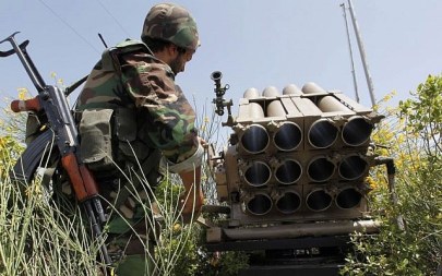A Hezbollah fighter stands behind an empty rocket launcher, May 22, 2010. (AP/Hussein Malla)