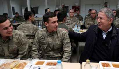Turkey's defense minister speaks with soldiers during a visit to Turkish troops stationed at the border with Syria, Kilis, Turkey, December 31, 2018.
