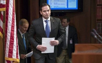 Sen. Marco Rubio (Republican, Florida), center, arrives for a news conference at the Capitol in Washington, March 7, 2018. (J. Scott Applewhite/AP)