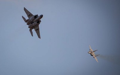 Israeli fighter jets performing an aerial show at a graduation ceremony at the Hatzerim Air Base in the Negev desert, December 26, 2018. (Aharon Krohn/Flash90)