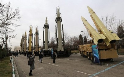 Iranians visit a weaponry and military equipment exhibition in the capital Tehran on February 2, 2019, organized on the occasion of the 40th anniversary of the Iranian revolution. Iran announced the successful test of a new cruise missile with a range of over 1,350 km. (some 840 miles). (ATTA KENARE / AFP)