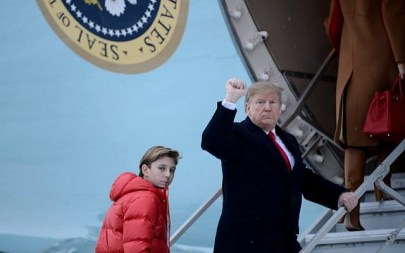 US President Donald Trump and son Barron Trump board Air Force One at Andrews Air Force Base in Maryland, en route to Palm Beach, Florida, on February 1, 2019. (Brendan Smialowski / AFP)