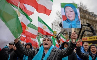 People wave former Iranian flags and a picture of Maryam Rajavi, leader of the People's Mujahedin of Iran, during a demonstration of the exiled Iranian opposition to protest against the Iranian government on February 8, 2019 in Paris. (AFP) People wave former Iranian flags and a picture of Maryam Rajavi, leader of the People's Mujahedin of Iran, during a demonstration of the exiled Iranian opposition to protest against the Iranian government on February 8, 2019 in Paris. (AFP)