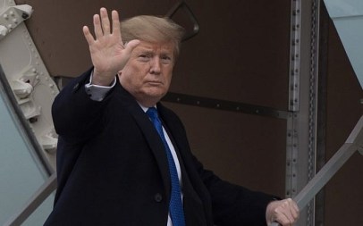 US President Donald Trump waves as he boards Air Force One at Andrews Air Force Base, MD, on February 15, 2019. (Jim Watson/AFP) US President Donald Trump waves as he boards Air Force One at Andrews Air Force Base, MD, on February 15, 2019. (Jim Watson/AFP)