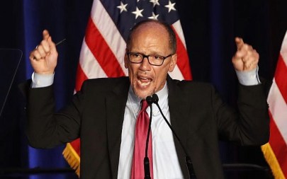 In this this Nov. 6, 2018, file photo, Tom Perez, Chairman of the Democratic National Committee, introduces Minority Leader Nancy Pelosi of Calif., as he speaks about Democratic wins in the House of Representatives to a crowd of Democratic supporters in Washington.(AP Photo/Jacquelyn Martin)