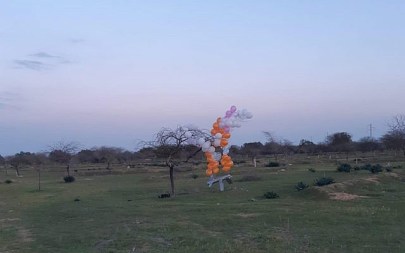 A cluster of balloons carrying what appears to be a cardboard model of a drone that was launched from the Gaza Strip touches down in southern Israel on February 20, 2019. (Eshkol Security)