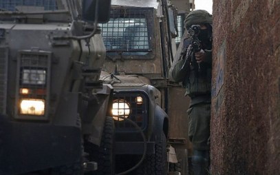 An Israeli soldier stands guard in the northern West Bank village of Salem, east of Nablus, on March 18, 2019, during a search operation for a Palestinian suspect. (JAAFAR ASHTIYEH / AFP)