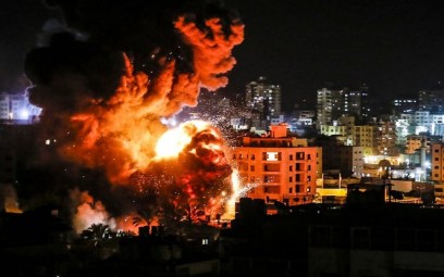 Fire and smoke around buildings in Gaza City during reported Israeli strikes on March 25, 2019. (Mahmud Hams/AFP)