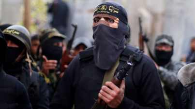 Islamic Jihad militants attend the funeral of Palestinian Jehad Hararah who was killed at the Israeli-Gaza border fence, in Gaza City. March 23, 2019