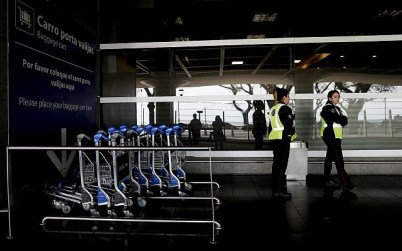 Police stand outside the airport in Buenos Aires, Argentina, Tuesday, Sept. 25, 2018. (AP/Natacha Pisarenko)