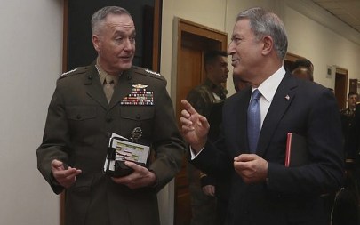 The US chairman of the Joint Chiefs of Staff, Gen. Joseph Dunford, left, and Turkey's Defence Minister Hulusi Akar speak during a meeting, in Ankara, Turkey, Tuesday, Jan. 8, 2019. (Turkish Defence Ministry via AP)