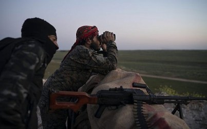In this Tuesday, Feb. 19, 2019 file photo, US-backed Syrian Democratic Forces fighters watch as an airstrike hits territory still held by Islamic State in the desert outside Baghouz, Syria (AP Photo/Felipe Dana, File) In this Tuesday, Feb. 19, 2019 file photo, US-backed Syrian Democratic Forces fighters watch as an airstrike hits territory still held by Islamic State in the desert outside Baghouz, Syria (AP Photo/Felipe Dana, File)