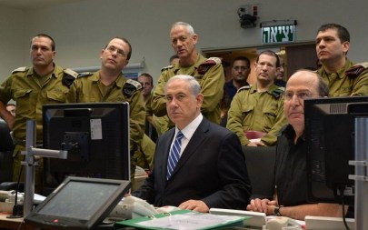 Illustrative: Prime Minister Benjamin Netanyahu with IDF chief Lt. Gen. Benny Gantz (standing directly behind him) and then-defense minister Moshe Ya'alon (seated right), monitoring IDF ground operations in Gaza during a meeting at the Kirya military headquarters in Tel Aviv on July 18, 2014. (Haim Zach/GPO/Flash90) Illustrative: Prime Minister Benjamin Netanyahu with IDF chief Lt. Gen. Benny Gantz (standing directly behind him) and then-defense minister Moshe Ya'alon (seated right), monitoring IDF ground operations in Gaza during a meeting at the Kirya military headquarters in Tel Aviv on July 18, 2014. (Haim Zach/GPO/Flash90)