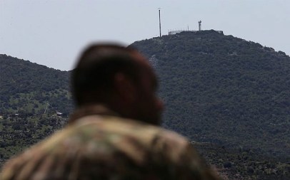 An Israeli military position is seen on a hill over Kfar Chouba, southeast Lebanon. April 9, 2019. (AP Photo/Hussein Malla)