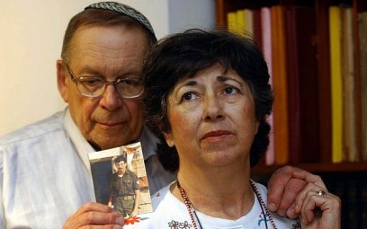 Miriam and Yoni Baumel in 2003 holding a picture of their son Zachary, who has been missing in action since 1982. (photo credit: Flash90)