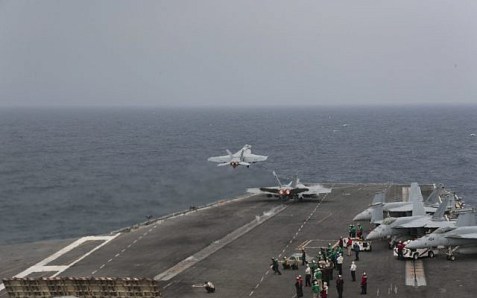Two F/A-18E Super Hornets launch from the flight deck of the Nimitz-class aircraft carrier USS Abraham Lincoln in the Mediterranean Sea, April 25, 2019.  (US Navy/Matt Herbst)