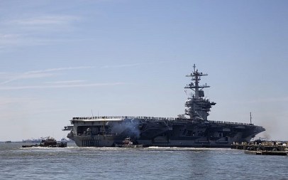 The USS Abraham Lincoln deploys from Naval Station Norfolk, in the vicinity of Norfolk, Virginia, on April 1, 2019. (Kaitlin McKeown/ The Virginian-Pilot via AP)