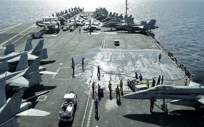 A picture taken on Wednesday, Feb. 15, 2012, through the bridge of the Nimitz-class aircraft carrier USS Abraham Lincoln (CVN 72) shows U.S. aircraft jets parked on the flight deck in the Strait of Hormuz. The USS Abraham Lincoln sailed from the Persian Gulf through the Strait of Hormuz on Tuesday. (AP Photo/Hassan Ammar)