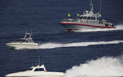 Illustrative: Patrol boats belonging to Iran's Islamic Revolutionary Guard Corps shadow the USS John C. Stennis aircraft carrier on December 21, 2018 (AP /Jon Gambrell) Illustrative: Patrol boats belonging to Iran's Islamic Revolutionary Guard Corps shadow the USS John C. Stennis aircraft carrier on December 21, 2018 (AP /Jon Gambrell)