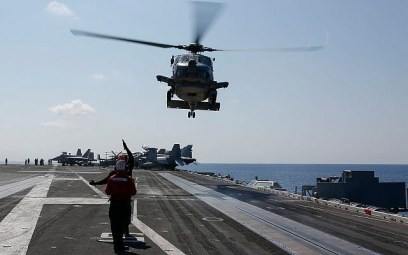 In this photo released by the US Navy, a Sea Hawk helicopter prepares to land on the flight deck of the USS Abraham Lincoln aircraft carrier in the Adriatic Sea, May 2, 2019. (US Navy/Michael Singley)
