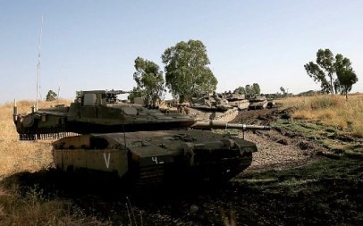Israeli soldiers manoeuver Merkava tanks in the Israeli-annexed Golan Heights on June 2, 2019. (Photo by JALAA MAREY / AFP)