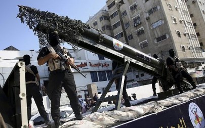 Palestinian members of the Al-Quds Brigades, the military wing of the Islamic Jihad terror group, parade with a replica rocket on a truck during a march on Oct. 4, 2018. (AP Photo/Adel Hana)