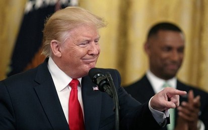 US President Donald Trump gestures into the audience as he speaks  in the East Room of the White House, Thursday June 13, 2019, in Washington. (AP Photo/Jacquelyn Martin)