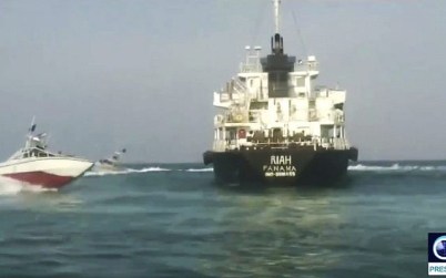 This undated photo provided by Iranian state television's English-language service, Press TV, on July 18, 2019, shows the Panamanian-flagged oil tanker MT Riah surrounded by Iranian Revolutionary Guard vessels. (Press TV via AP)