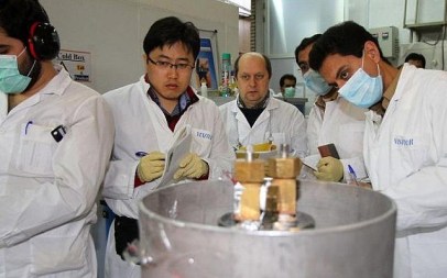 Illustrative. International Atomic Energy Agency inspectors (2nd and 3rd left) and Iranian technicians at Natanz nuclear power plant, south of Tehran, on January 20, 2014. (Kazem Ghane/IRNA/AFP/File)