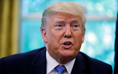 US President Donald Trump speaks during a signing ceremony in the Oval Office of the White House in Washington, July 1, 2019. (AP Photo/Carolyn Kaster)