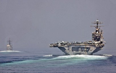Illustrative: The guided-missile cruiser USS Cape St. George and the aircraft carrier USS Abraham Lincoln transit the Strait of Hormuz. (CC-BY SA 3.0/Official US Navy Imagery)