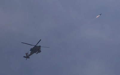 Israeli Air Force helicopter fires a missile into Gaza, near the Gaza-Israel border, May 5, 2019. (AP Photo/Ariel Schalit)